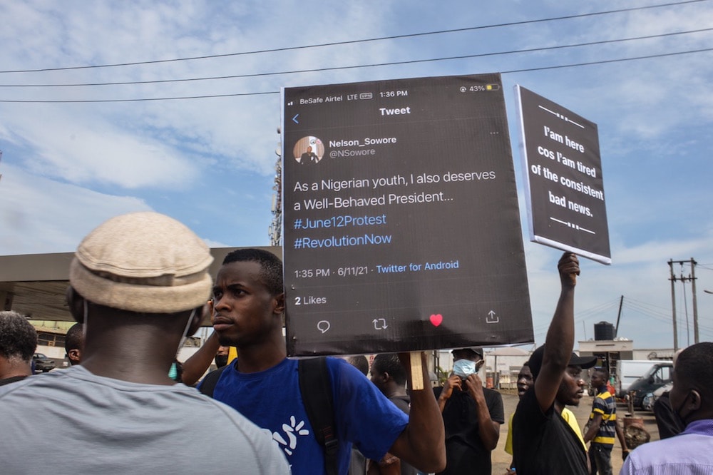 Protesters hold banners, some with tweets, during a demonstration against bad governance and the Twitter ban, in the Ojota district of Lagos, Nigeria, 12 June 2021, Olukayode Jaiyeola/NurPhoto via Getty Images
