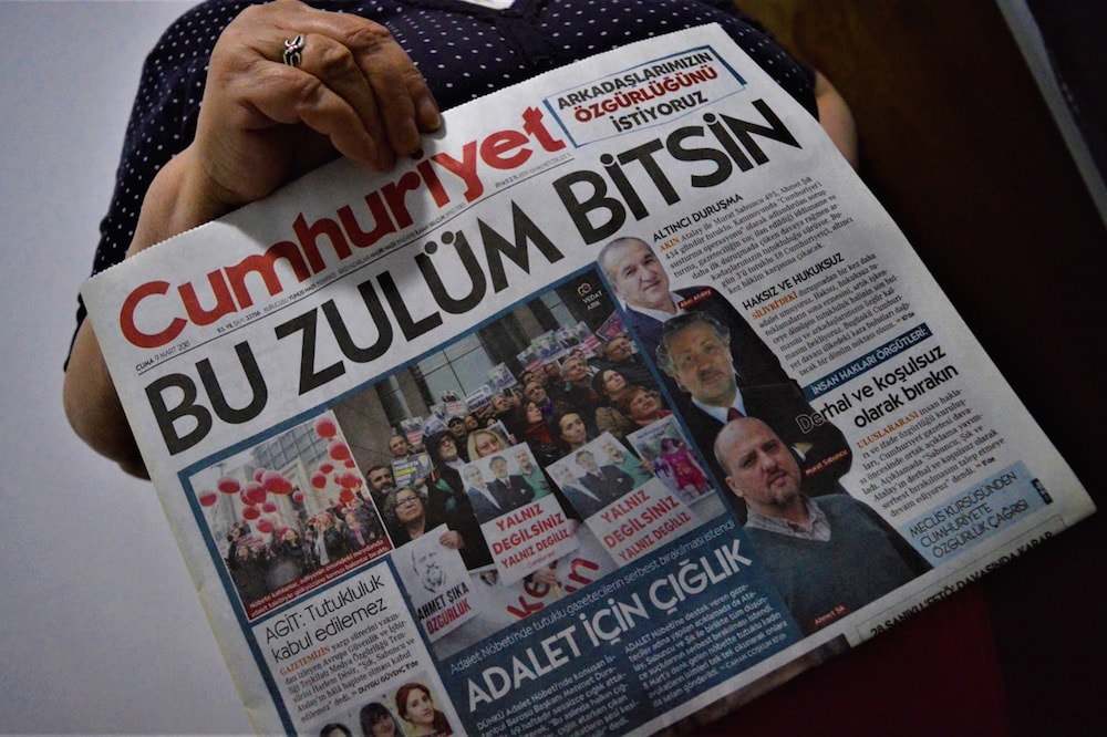 The front page of "Cumhuriyet" depicts the on-going trial in Istanbul against the paper's journalists and executives on terrorism charges, with a headline that reads 'Let this oppression end', 9 March 2018, Altan Gocher/NurPhoto via Getty Images