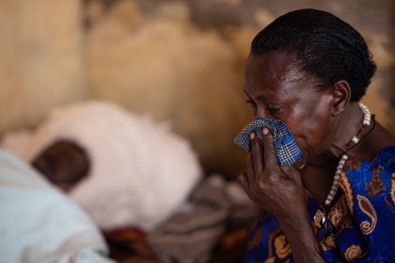 The mother of a young man who was shot dead by government forces during an election-related protest, reacts to her son's death as she sits by his body, Kampala, Uganda, 19 November 2020, Getty Images/Getty Images