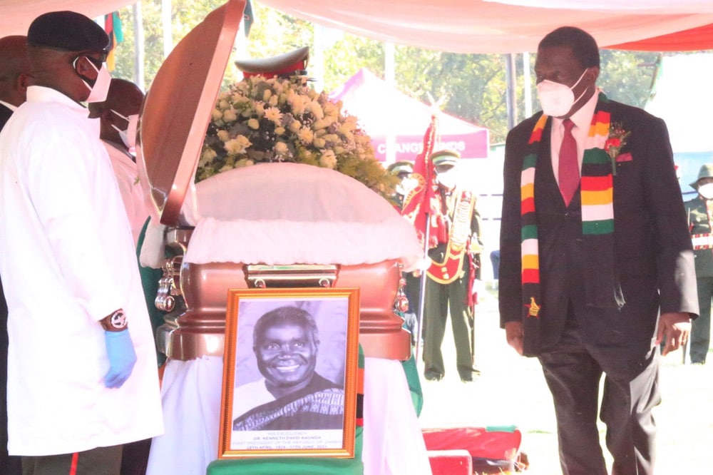 Zimbabwean President Emmerson Mnangagwa pays his last respects to the late former Zambian President Kenneth Kaunda during his state memorial service, in Lusaka, Zambia, 2 July 2021, -/AFP via Getty Images