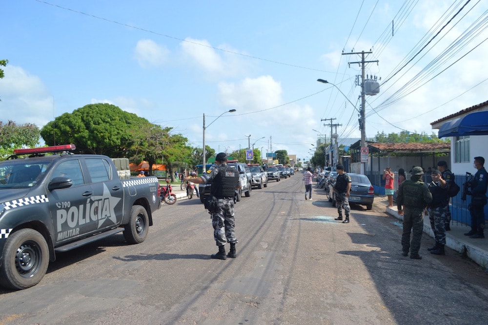 Police officers stand guard outside a police station attacked during a bank robbery, in Cameta, Pará State, Brazil, 2 December 2020, JURANDIR VIANA/AFP via Getty Images