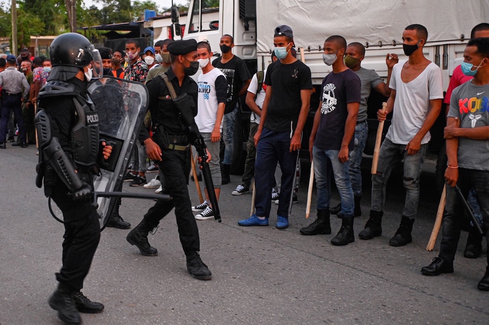 Riot police patrol the streets after a demonstration against the government of President Miguel Diaz-Canel, in Arroyo Naranjo Municipality, Havana, Cuba, 12 July 2021, YAMIL LAGE/AFP via Getty Images
