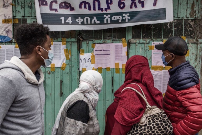 Voters look at tallies posted outside a polling station in Addis Ababa, Ethiopia, 22 June 2021; Ethio Forum had critically reported on the elections. MARCO LONGARI/AFP via Getty Images