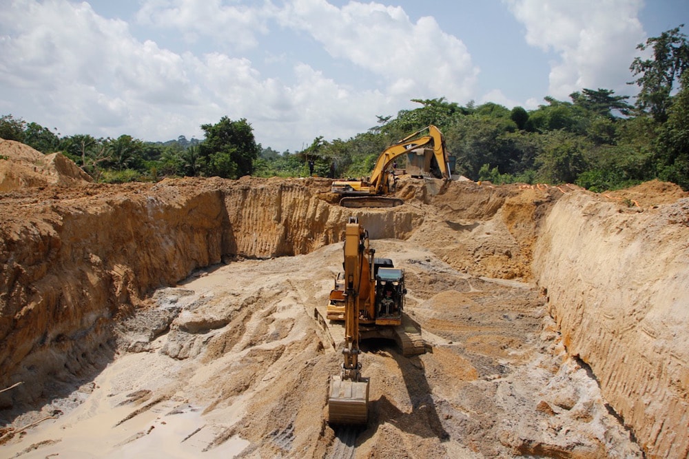 Excavators work on a small-scale mining site near Dunkwa-on-Offin, central Ghana, 16 June 2013, Chris Stein/AFP via Getty Images