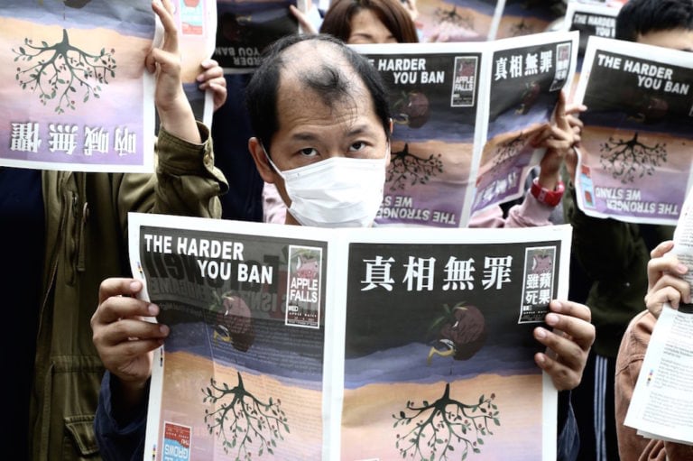 People gather to protest against the closure in Hong Kong of the "Apple Daily" newspaper, in London, United Kingdom, 27 June 2021, Hasan Esen/Anadolu Agency via Getty Images