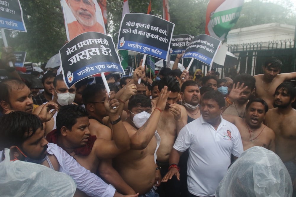 Members of the Indian Youth Congress protest against the government's alleged use of Pegasus spyware for surveillance, in New Delhi, India, 19 July 2021, Pankaj Nangia/Anadolu Agency via Getty Images