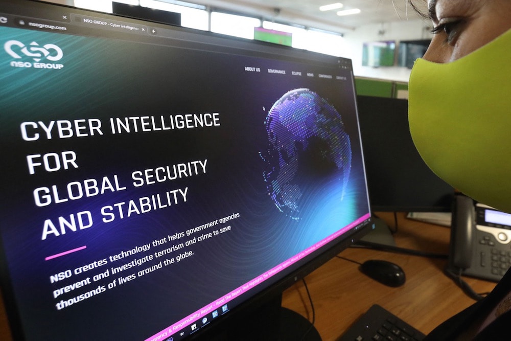 A woman checks the website of the Israeli company NSO Group, at an office in Nicosia, Cyprus, 21 July 2021, MARIO GOLDMAN/AFP via Getty Images