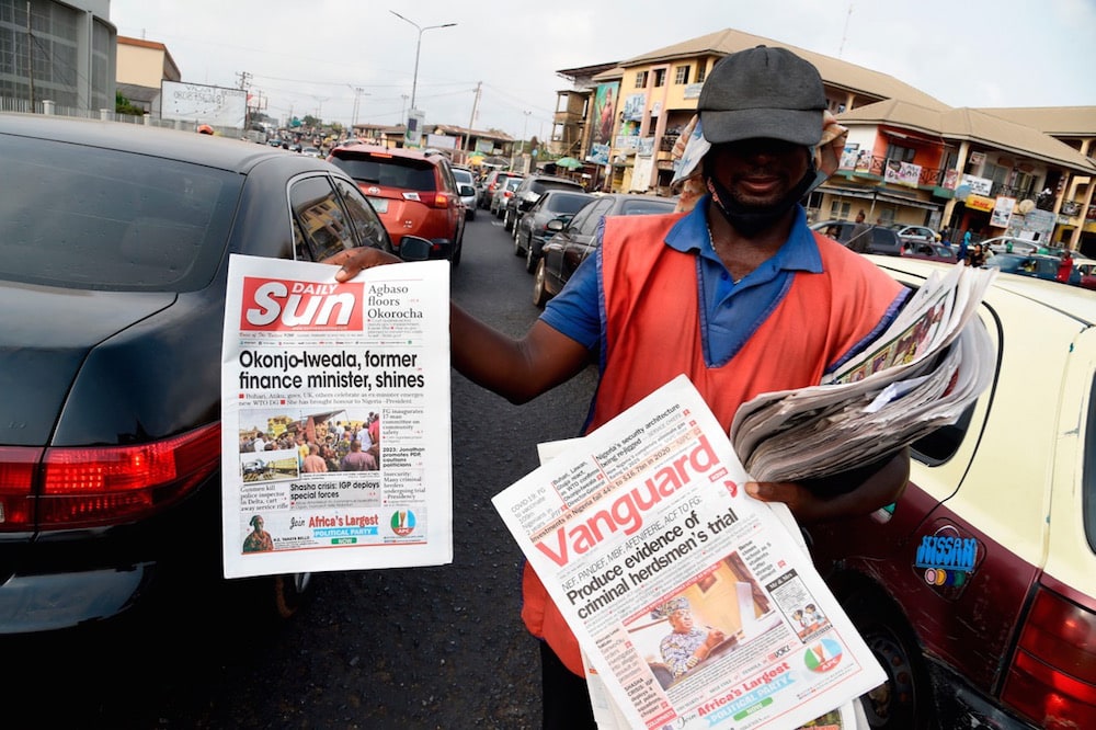 A roadside newspaper vendor in Ibadan, Nigeria, 16 February 2021, PIUS UTOMI EKPEI/AFP via Getty Images