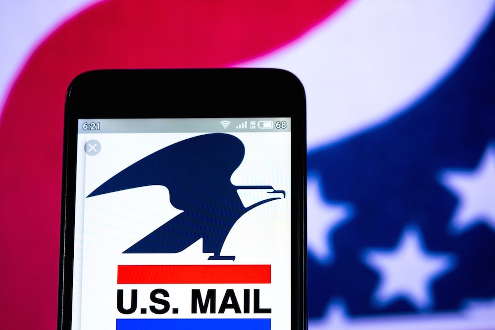 In this photo illustration a United States Postal Service logo is displayed on a smartphone, 1 July 2019, Igor Golovniov/SOPA Images/LightRocket via Getty Images