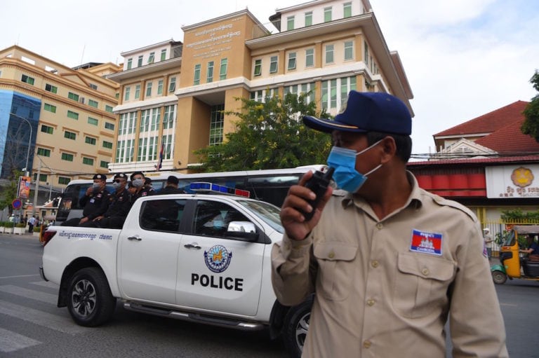 Police patrol in front of the Phnom Penh municipal court during a mass trial of more than 100 opposition members and activists, Cambodia, 26 November 2020, TANG CHHIN SOTHY/AFP via Getty Images