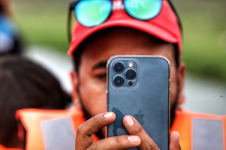 A man shoots video with an Apple iPhone during a visit to the Wular Lake, Jammu and Kashmir, India, 20 May 2021, Nasir Kachroo/NurPhoto via Getty Images
