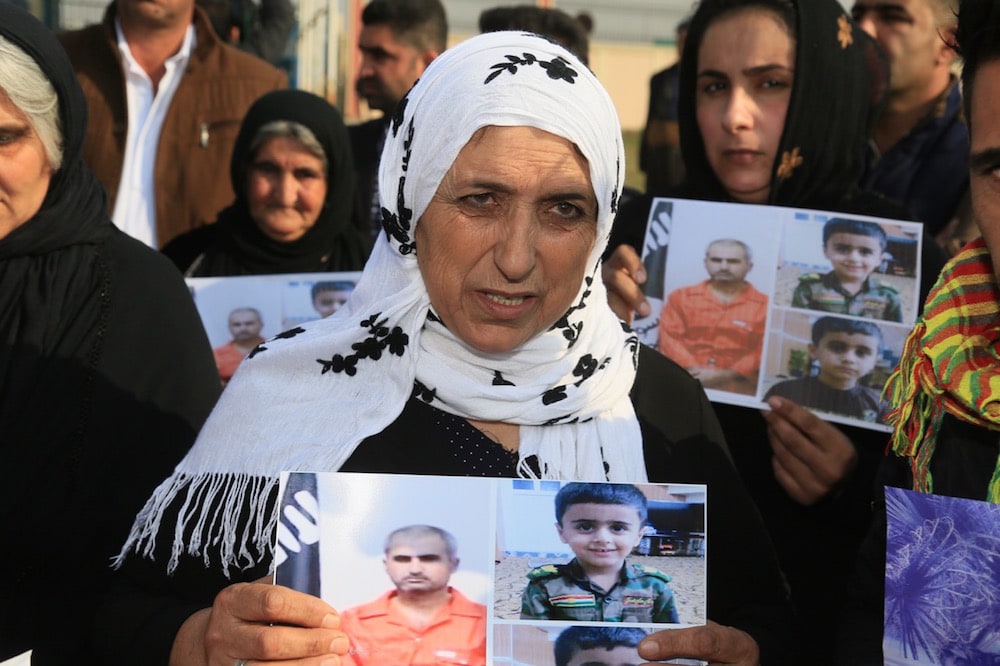 Erbil, Iraq, 16 January 2018. People gather near the United Nations (UN) office to demand that their relatives be found, relatives who disappeared during anti-Daesh operations, Yunus Keles/Anadolu Agency/Getty Images