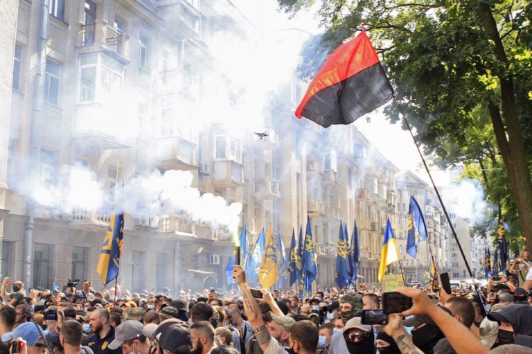 People light flares during a rally by nationalist groups, outside the Office of the President of Ukraine, in Kyiv, 14 August 2021, Anna MarchenkoTASS via Getty Images