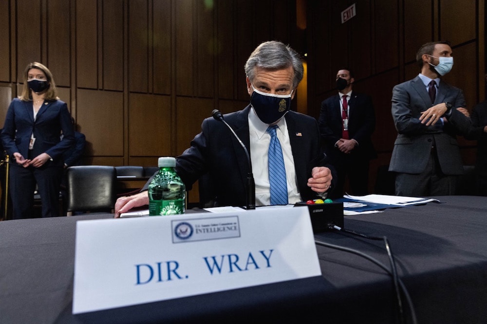 FBI Director Christopher Wray prepares to testify during a Senate Select Committee on Intelligence hearing, on Capitol Hill, in Washington, DC, 14 April 2021, GRAEME JENNINGS/POOL/AFP via Getty Images