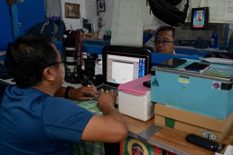 A photojournalist works at a press office, on the World Press Freedom Day in Manila, Philippines, 3 May 2023. Photo by JAM STA ROSA/AFP via Getty Images